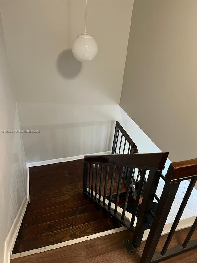 stairs with wood-type flooring