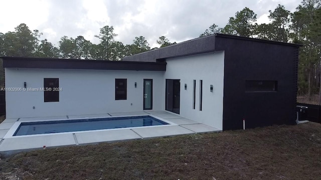 rear view of property with a patio area