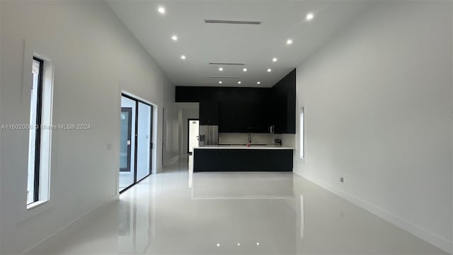 kitchen with stainless steel fridge with ice dispenser