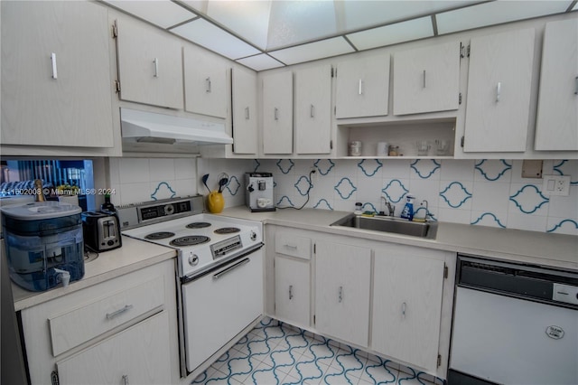 kitchen featuring white cabinets, white appliances, tasteful backsplash, and sink