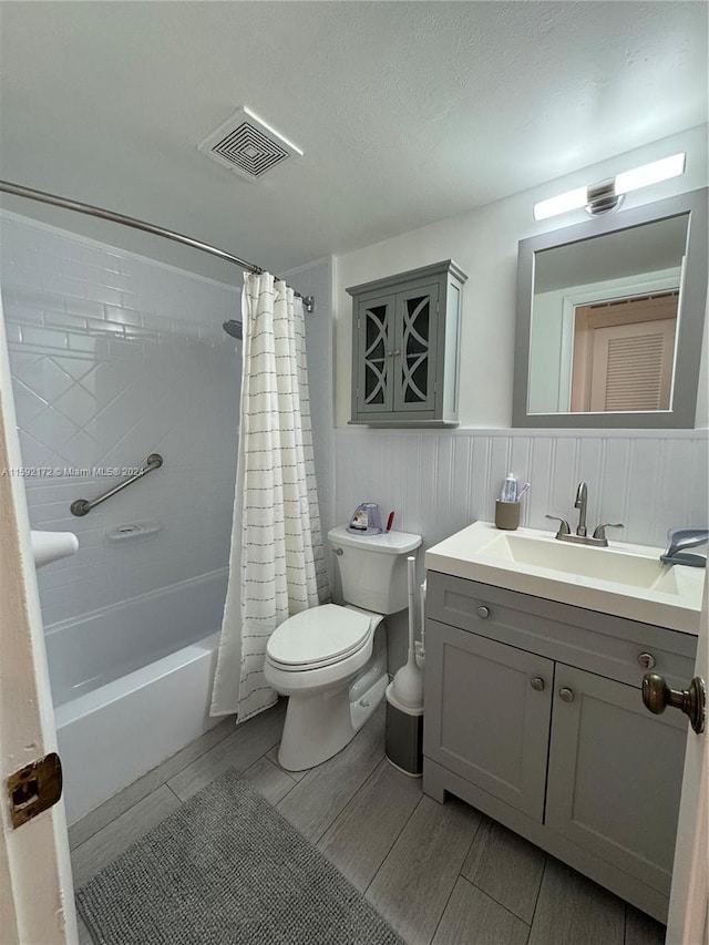 full bathroom featuring vanity, toilet, and shower / bath combo with shower curtain