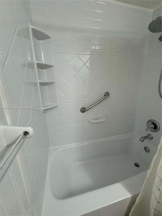 bathroom with shower / tub combo with curtain