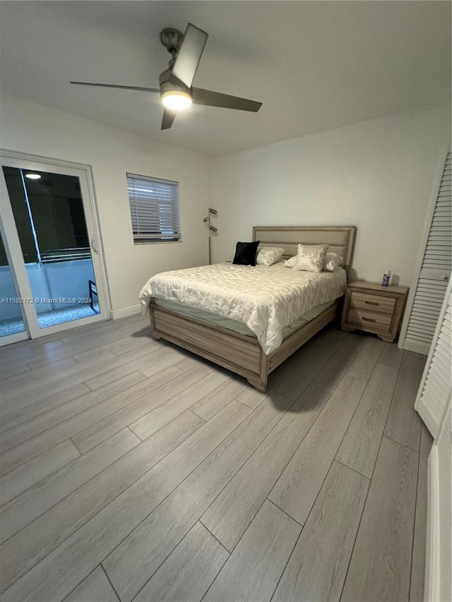 bedroom with access to outside, ceiling fan, and light hardwood / wood-style floors