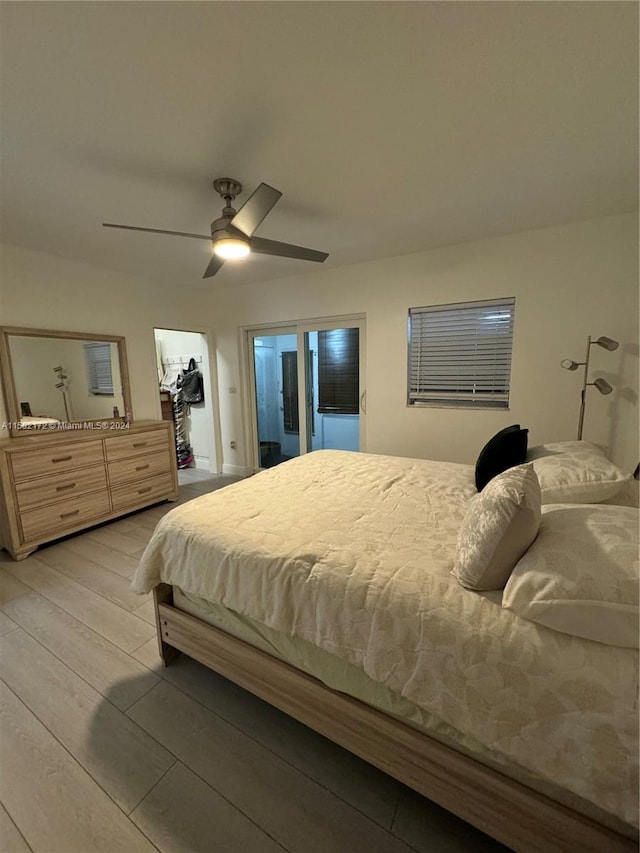 bedroom with light wood-type flooring and ceiling fan