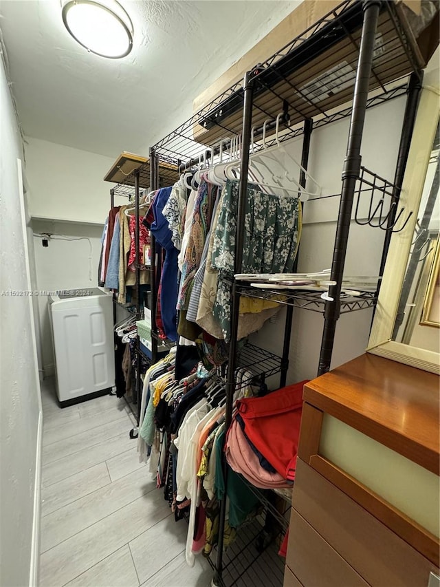 walk in closet featuring washer / dryer