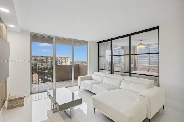 tiled living room with floor to ceiling windows