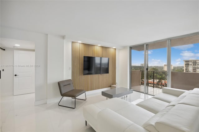 tiled living room featuring expansive windows