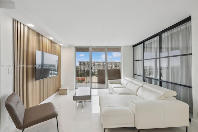 tiled living room with floor to ceiling windows