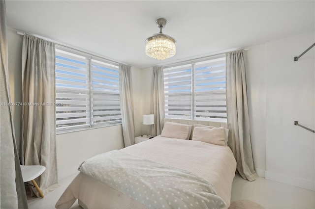 bedroom featuring a chandelier