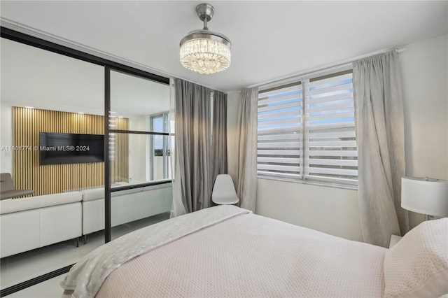 bedroom with an inviting chandelier