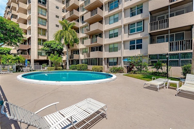 view of swimming pool with a patio