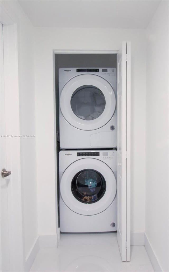 laundry area with stacked washer / drying machine