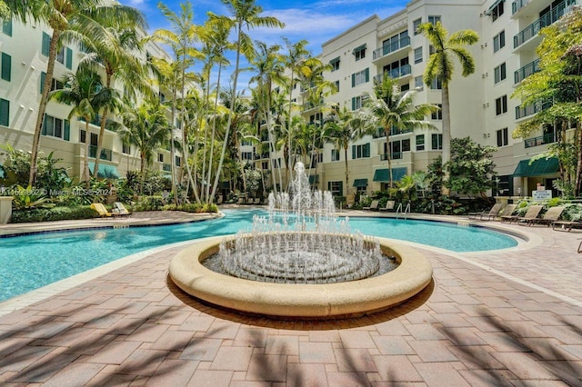 view of swimming pool featuring pool water feature