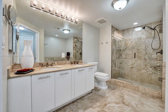 bathroom featuring walk in shower, vanity, and toilet