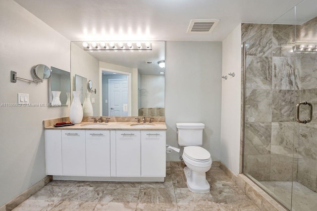 bathroom featuring vanity, toilet, and walk in shower