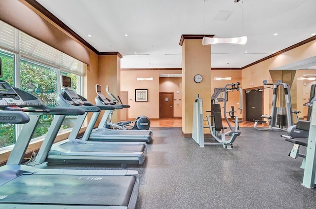 workout area featuring ornamental molding