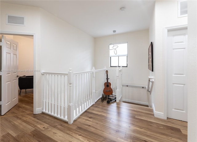 hall with wood-type flooring