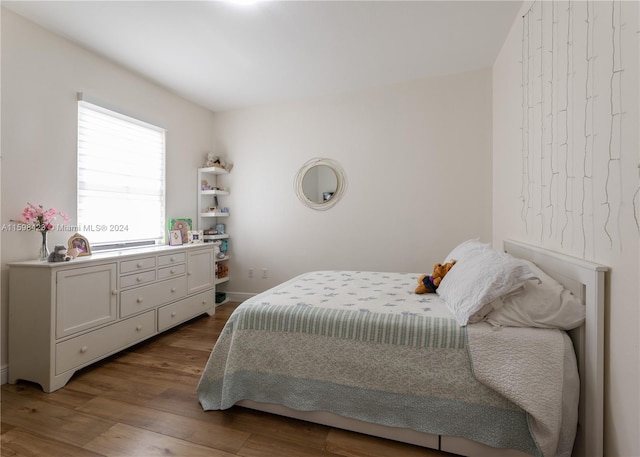 bedroom featuring hardwood / wood-style flooring