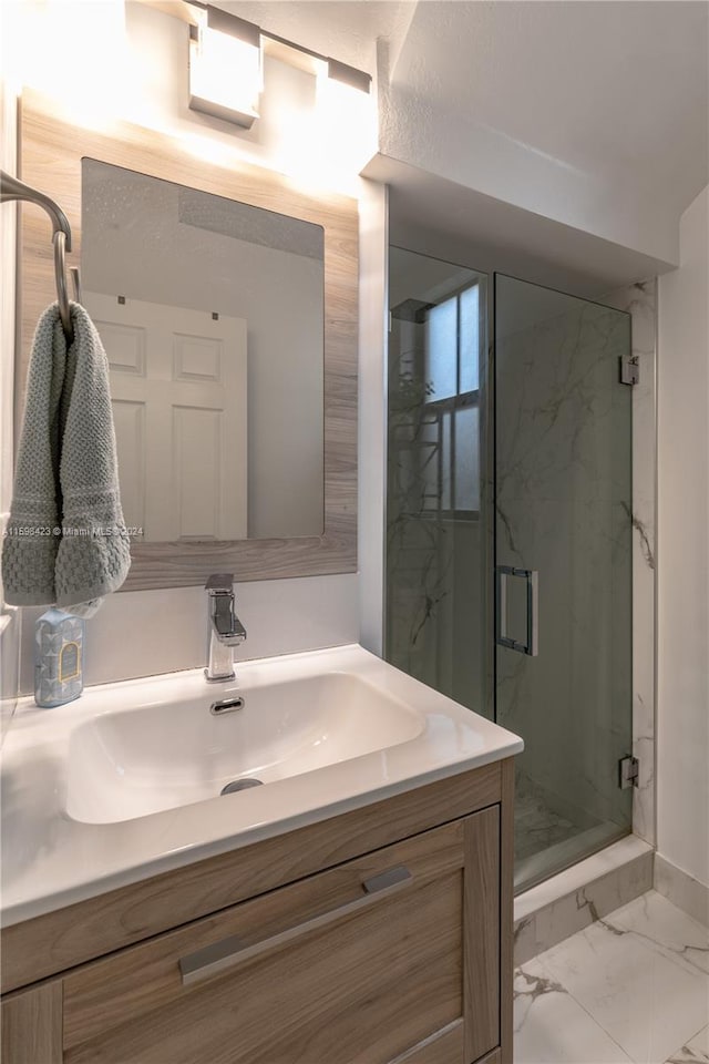 bathroom with vanity and walk in shower