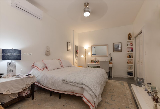 bedroom featuring ceiling fan, a closet, and an AC wall unit