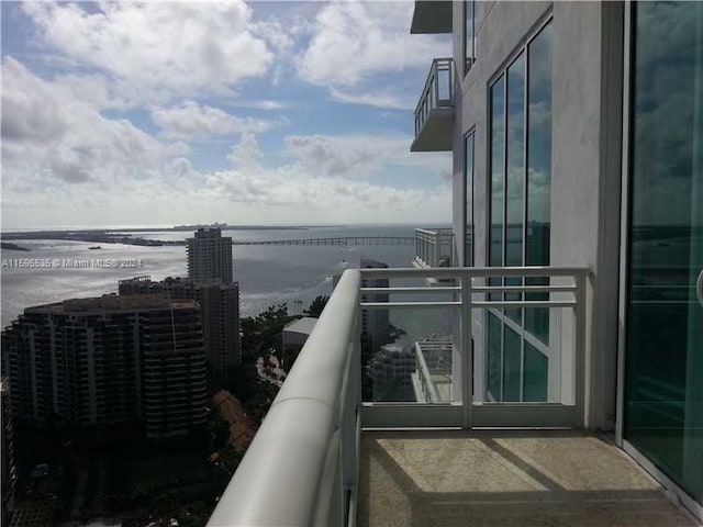 balcony featuring a water view