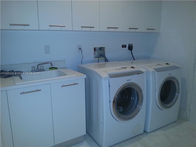 900 Brickell Key Blvd Unit 2803, Miami, FL 33131 - washroom with cabinet space and washer and dryer