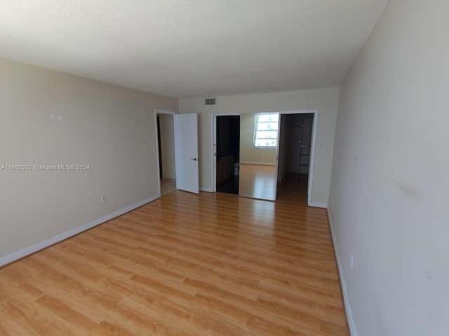 spare room with light wood-type flooring