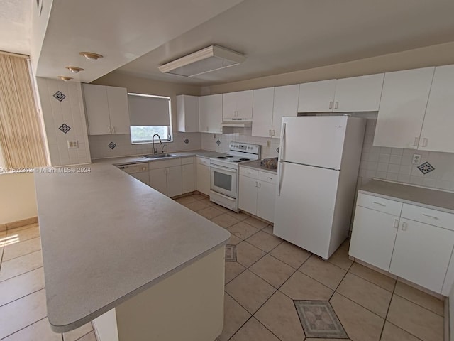 kitchen featuring tasteful backsplash, white appliances, sink, white cabinetry, and light tile patterned flooring