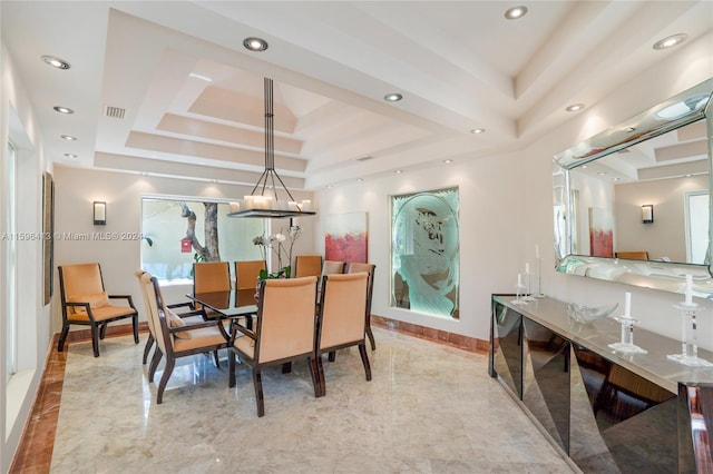 dining room with a tray ceiling