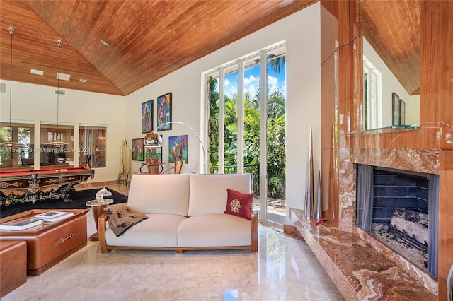 living area featuring plenty of natural light and wood ceiling