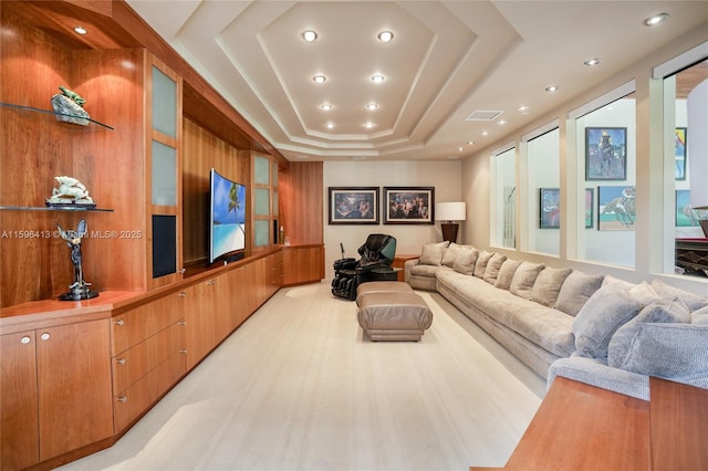 living room featuring a tray ceiling