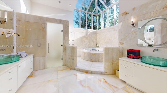 bathroom with tile patterned flooring, vanity, and tile walls