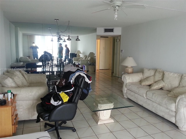 living room featuring tile patterned flooring and ceiling fan