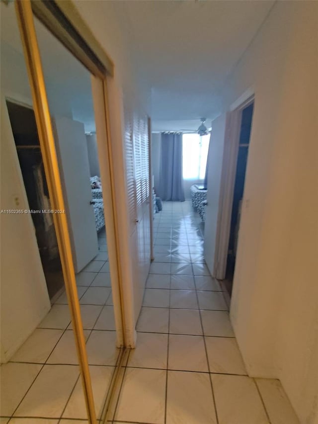 corridor featuring light tile patterned floors