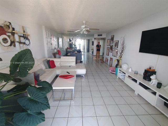 tiled living room featuring ceiling fan