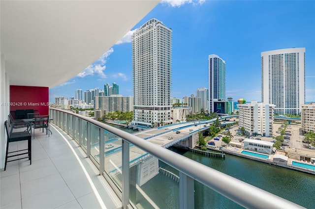 balcony featuring a water view