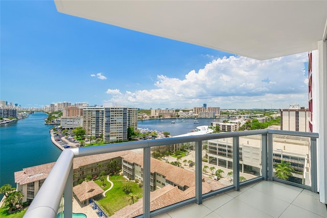 balcony with a water view and a city view