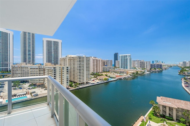 balcony featuring a water view and a view of city