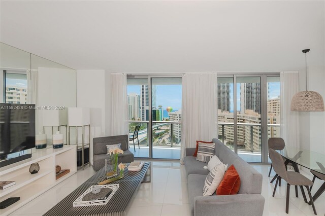 tiled living room featuring a wall of windows and a city view