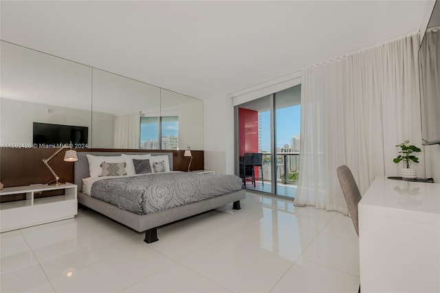 tiled bedroom with access to exterior, floor to ceiling windows, and multiple windows