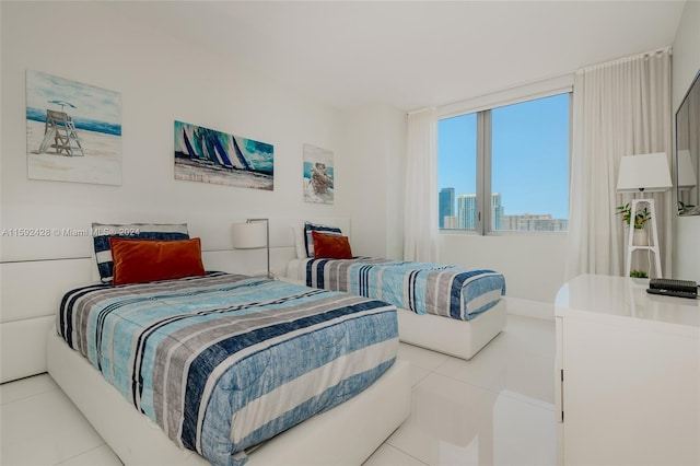 tiled bedroom featuring a city view