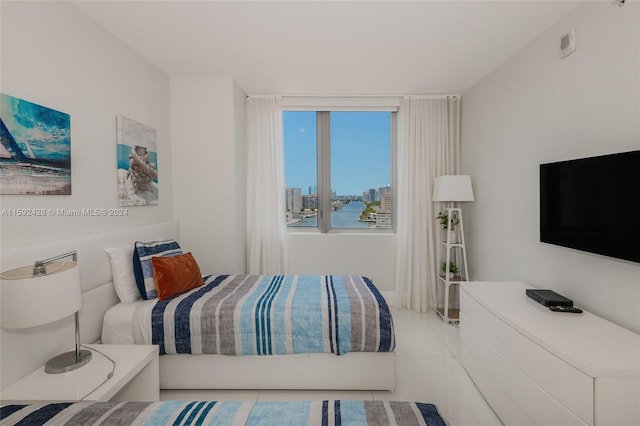 bedroom featuring light tile patterned floors