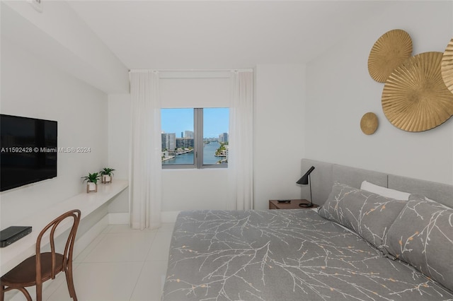 tiled bedroom with a view of city