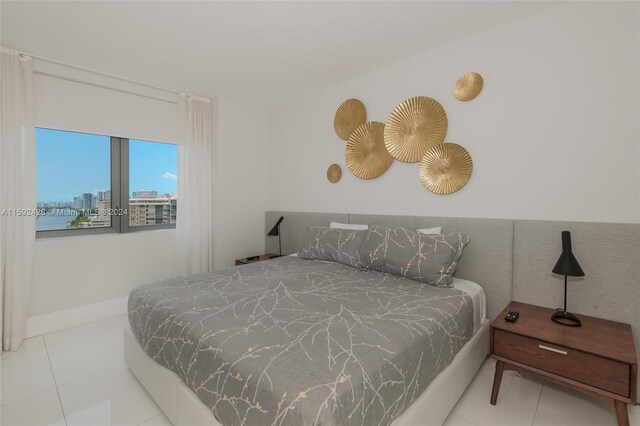 tiled bedroom featuring a view of city