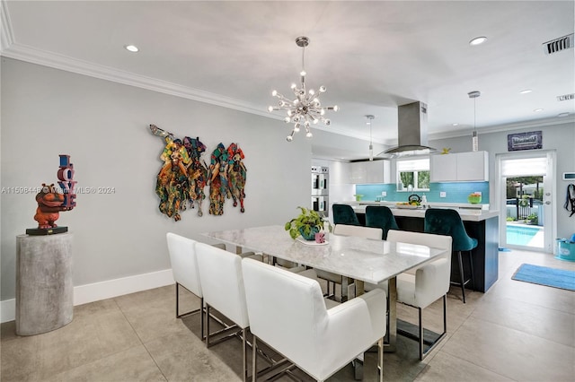 dining space with an inviting chandelier and ornamental molding