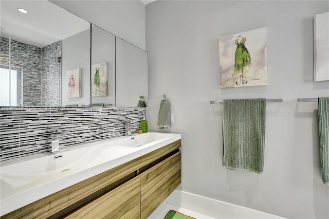 bathroom with vanity and a shower with door