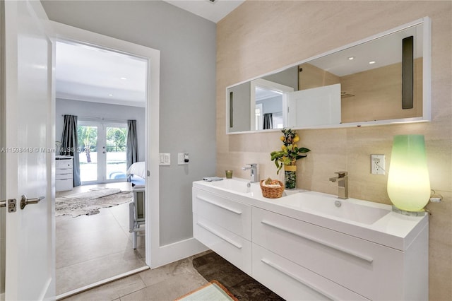 bathroom with french doors and vanity