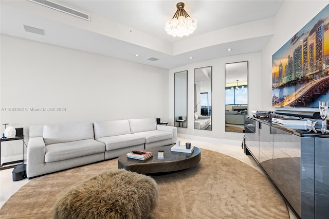 living room with an inviting chandelier