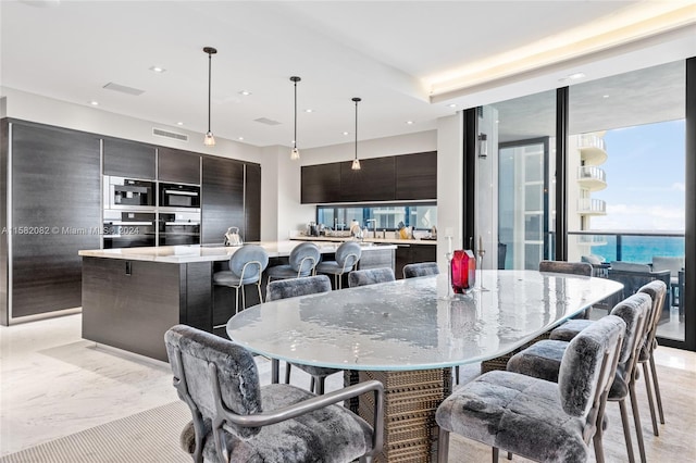 dining space featuring expansive windows