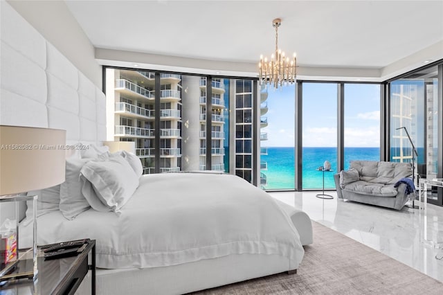 tiled bedroom with multiple windows, an inviting chandelier, a water view, and access to exterior